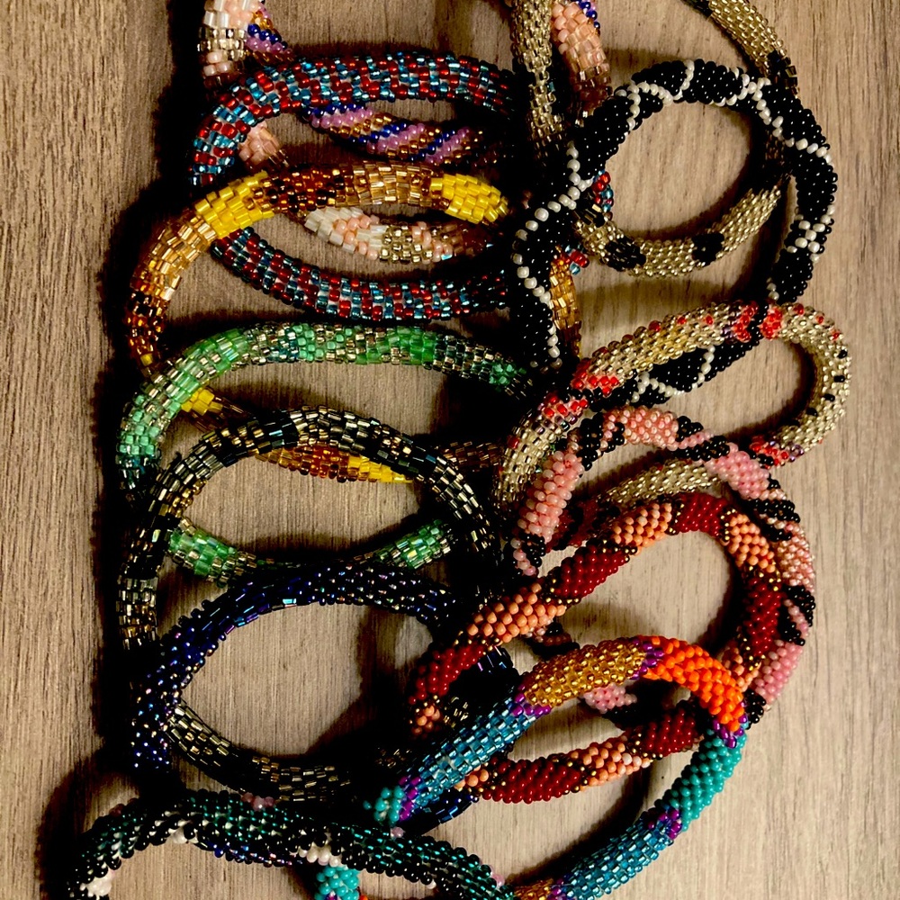 Set of 14 seed bracelets.